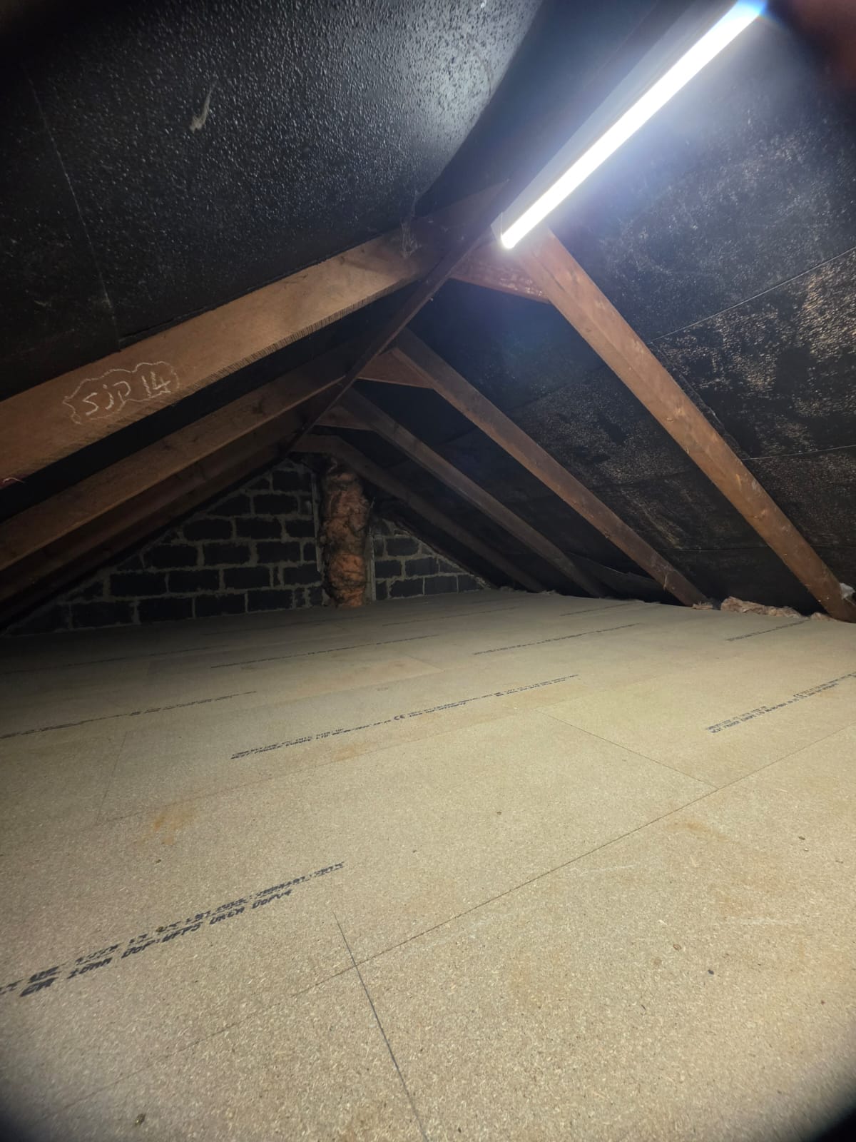 Aluminium sliding loft ladder securely installed for easy access